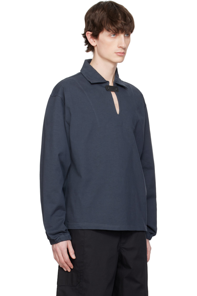 Cotton jersey polo. 

· Spread collar
· Button tab at open placket
· Logo embroidered at front
· Elasticized cuffs

Supplier color: Charcoal