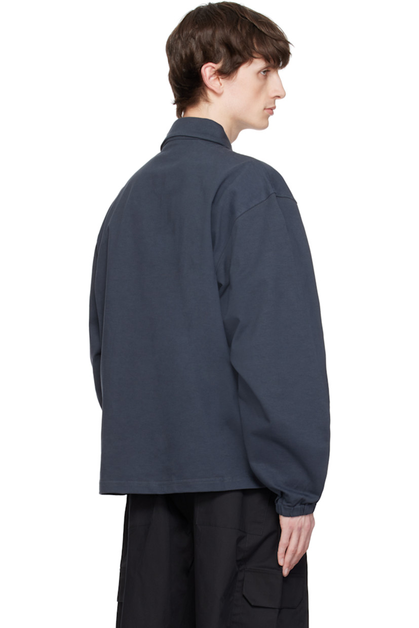Cotton jersey polo. 

· Spread collar
· Button tab at open placket
· Logo embroidered at front
· Elasticized cuffs

Supplier color: Charcoal