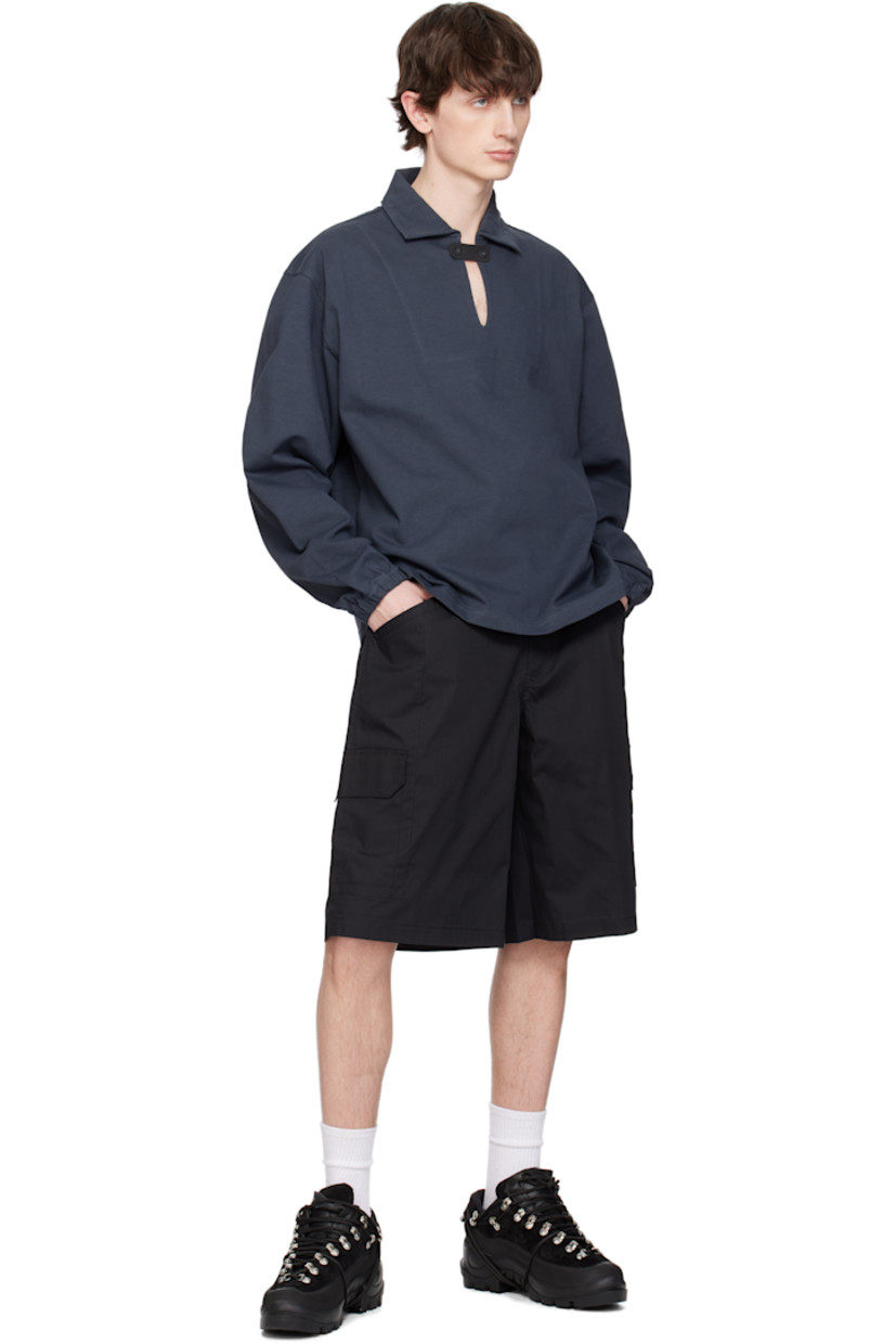 Cotton jersey polo. 

· Spread collar
· Button tab at open placket
· Logo embroidered at front
· Elasticized cuffs

Supplier color: Charcoal