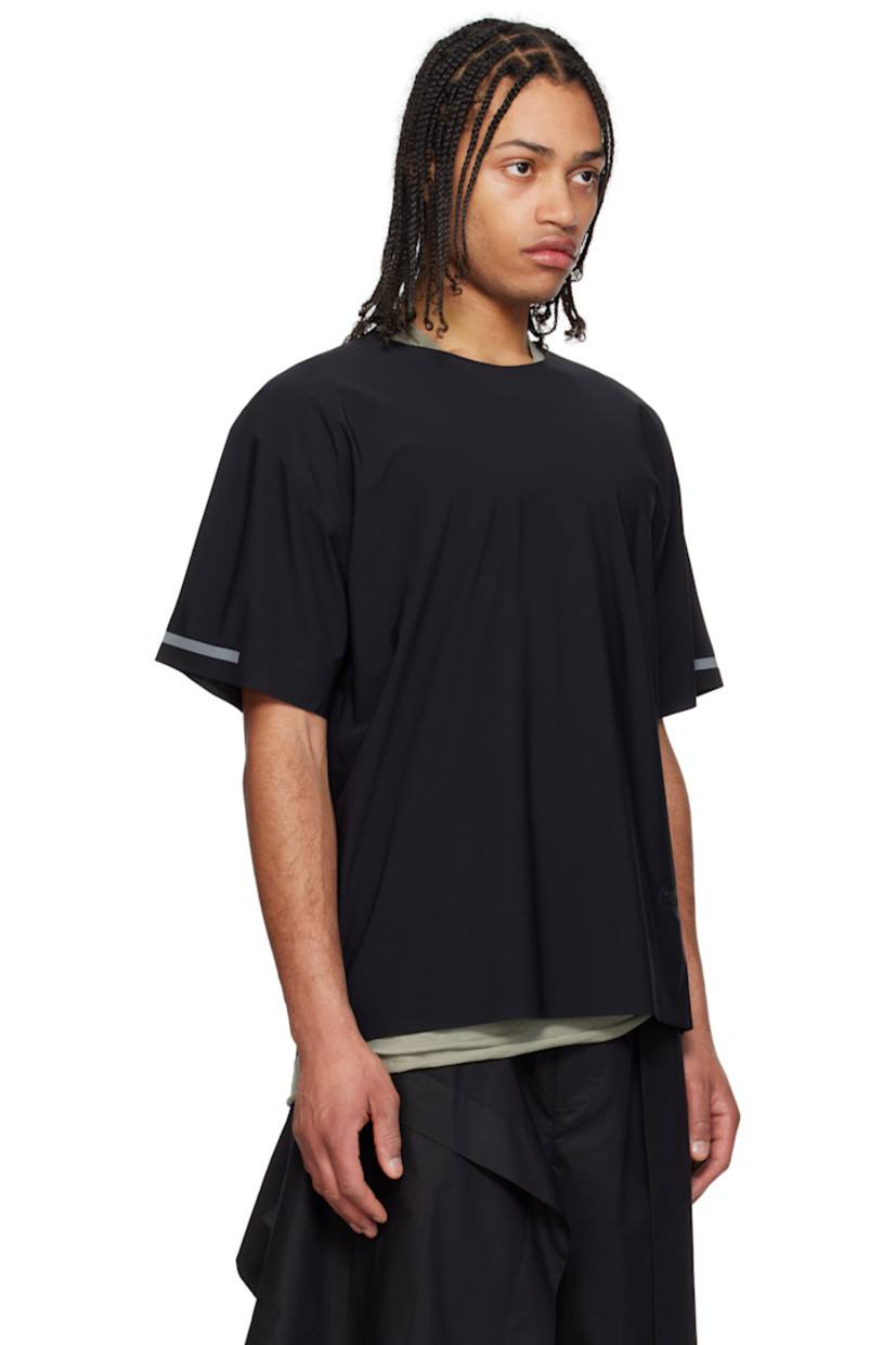 Stretch nylon jersey T-shirt. Laser-cut raw edges and taped seams throughout. 

· Crewneck 
· Logo embroidered at hem
· Reflective trim at cuffs and back 

Supplier color: Black