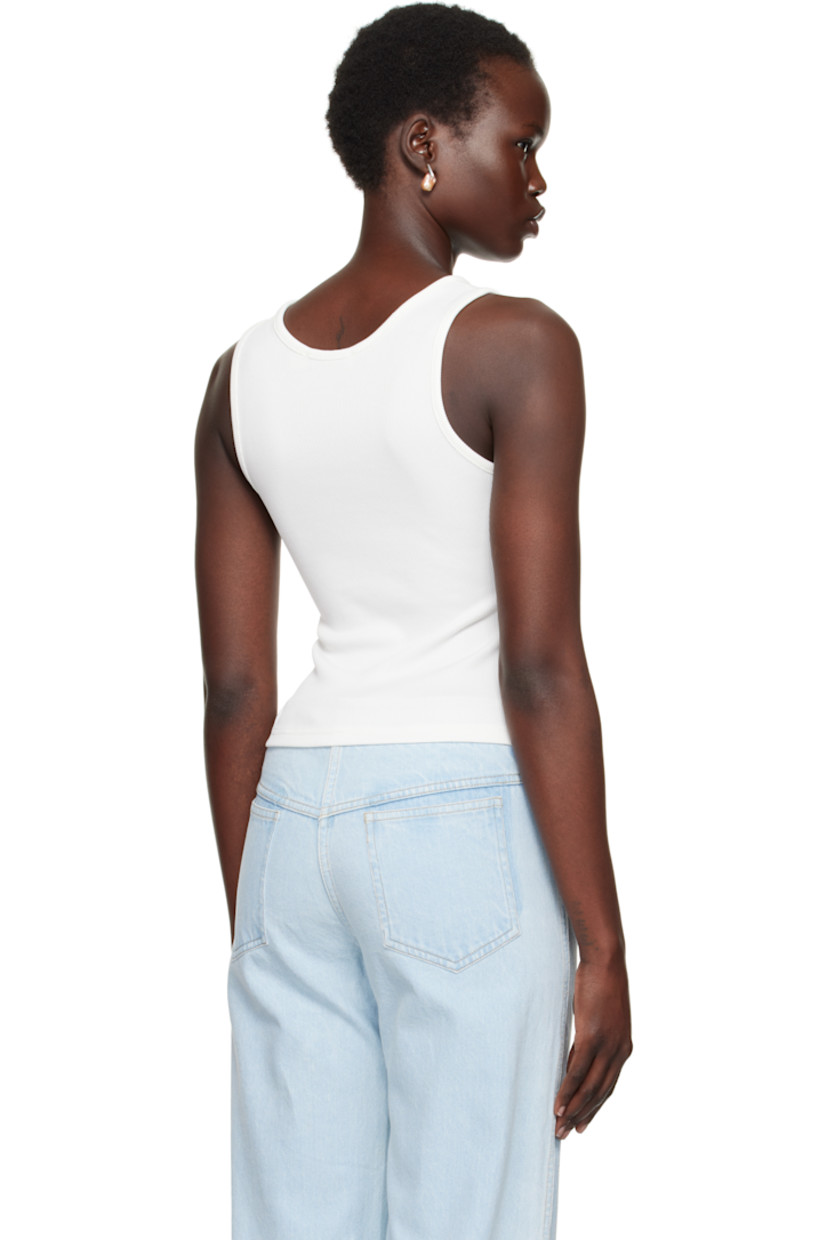 Stretch polyester ribbed jersey tank top.

· V-neck
· Twisted keyhole at front
· Notch at front hem

Supplier color: White