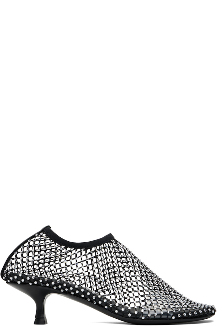 Sheer mesh heels in black.

· Crystal-cut accents throughout
· Square toe
· Elasticized collar
· Covered kitten heel with rubber injection
· Leather sole
· Heel: H1.75"

Supplier color: Black