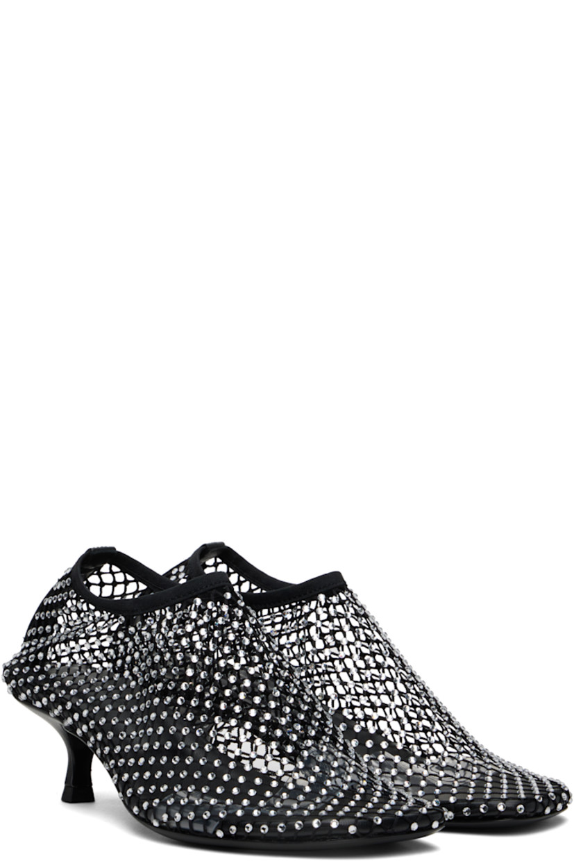 Sheer mesh heels in black.

· Crystal-cut accents throughout
· Square toe
· Elasticized collar
· Covered kitten heel with rubber injection
· Leather sole
· Heel: H1.75"

Supplier color: Black