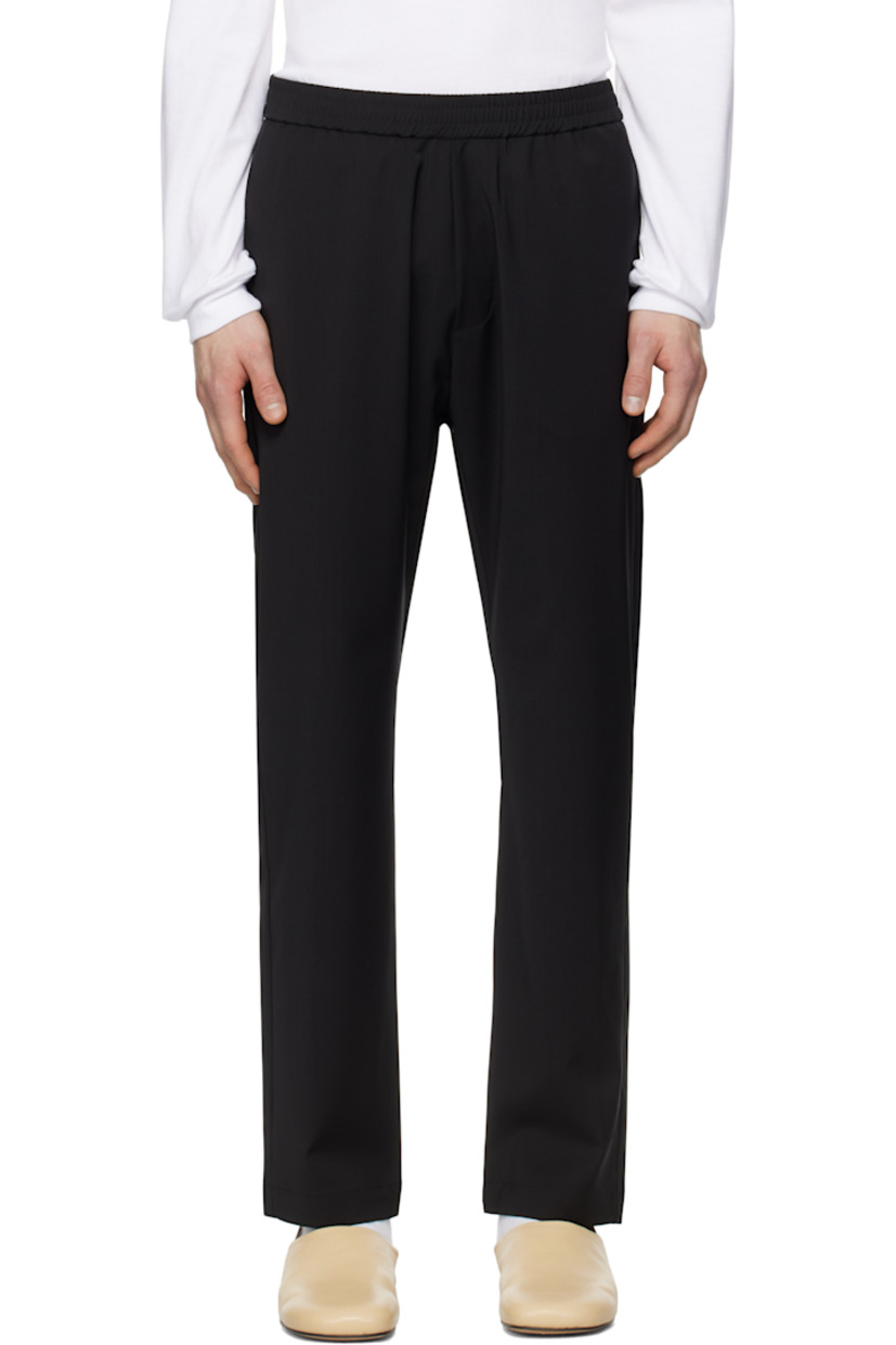 Tropical wool barathea trousers.

· Concealed drawstring at elasticized waistband
· Four-pocket styling
· Mock-fly

Supplier color: Nero