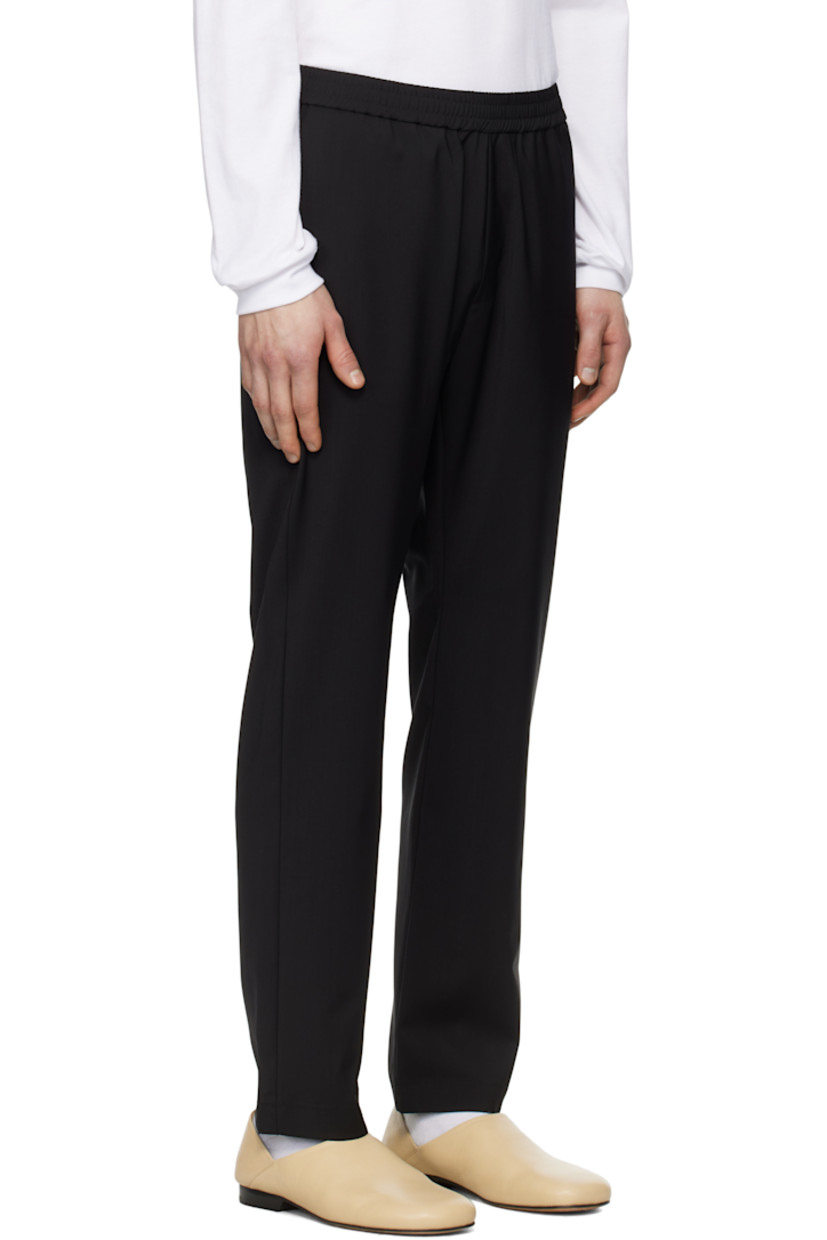 Tropical wool barathea trousers.

· Concealed drawstring at elasticized waistband
· Four-pocket styling
· Mock-fly

Supplier color: Nero