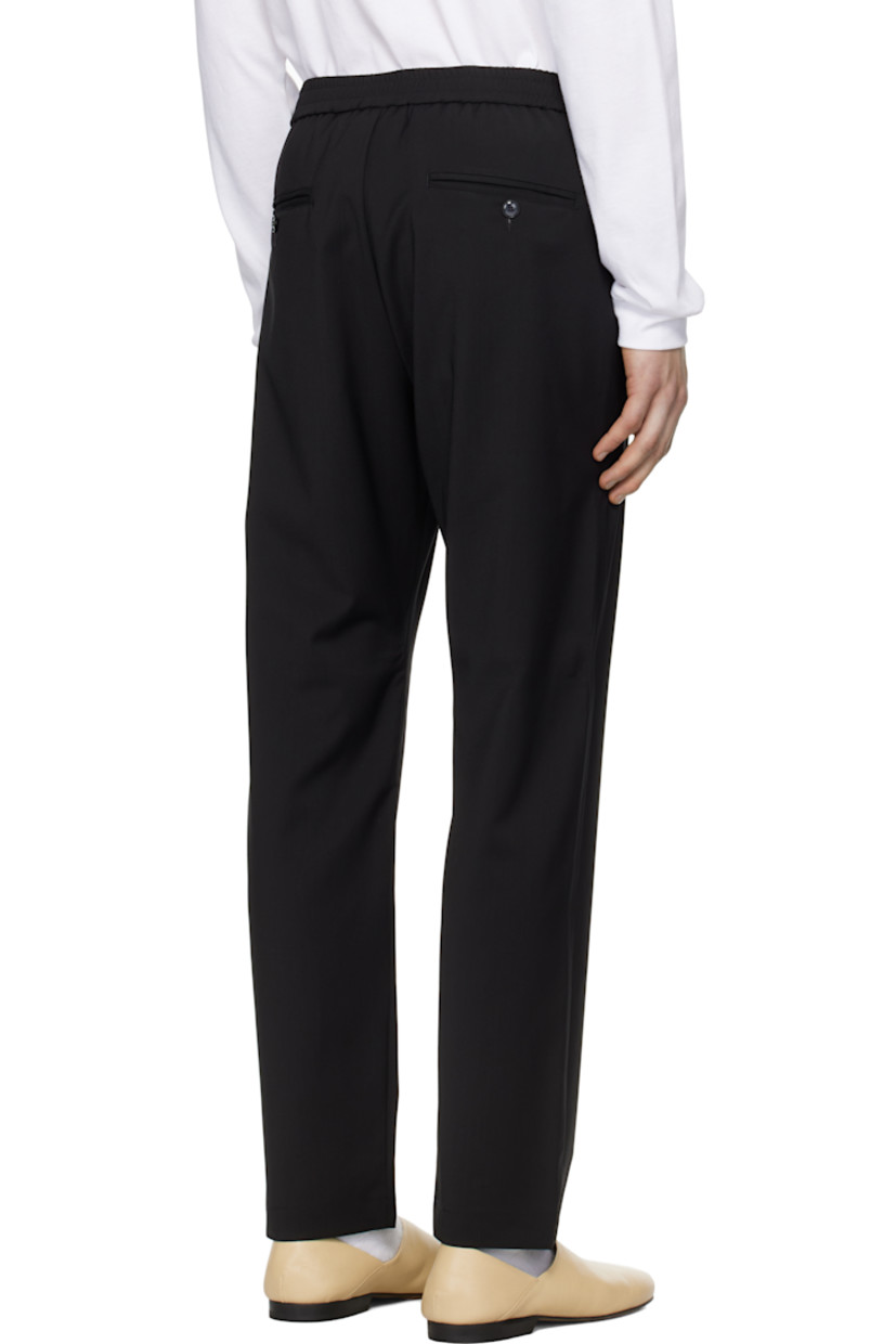 Tropical wool barathea trousers.

· Concealed drawstring at elasticized waistband
· Four-pocket styling
· Mock-fly

Supplier color: Nero