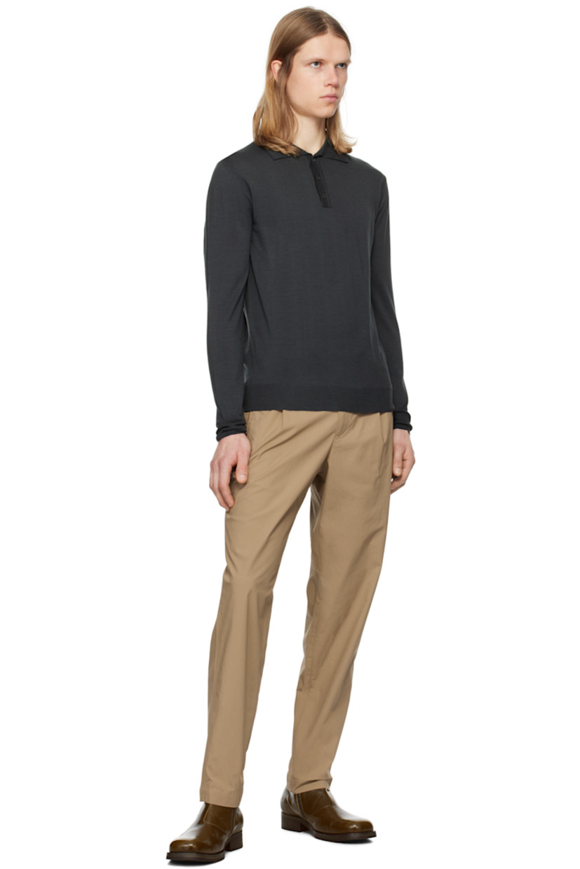 Slim-fit stretch cotton poplin trousers. 

· Mid-rise
· Belt loops 
· Adjustable button tabs at waistband 
· Four-pocket styling
· Zip-fly
· Pleats at front

Supplier color: Khaki
