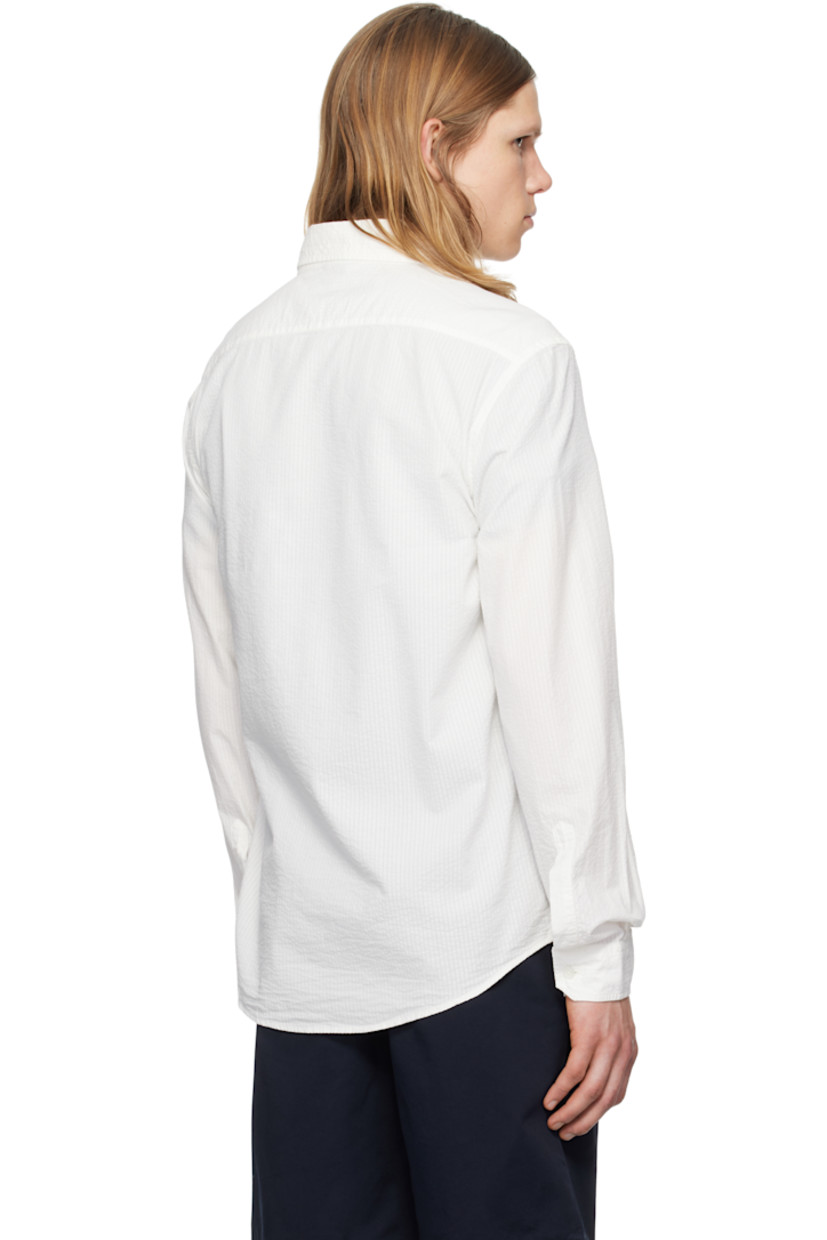 Cotton seersucker shirt. Stripes throughout.

· Oversized
· Spread collar
· Button closure
· Patch pocket
· Shirttail hem
· Single-button barrel cuffs

Supplier color: Bianco
