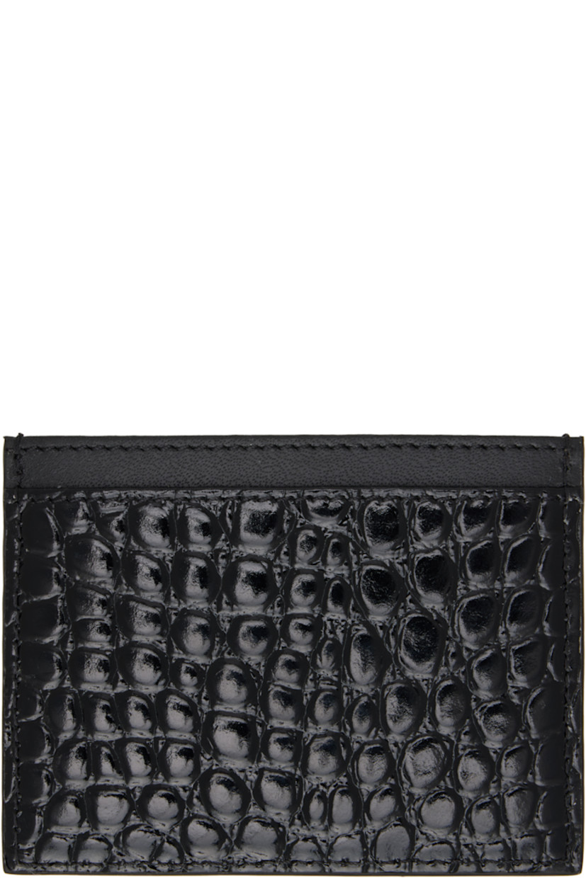 Croc-embossed patent calfskin card holder in black.

· Logo hardware at face
· Four card slots
· Central note slot
· Twill lining
· H3" x W4"

Supplier color: Black