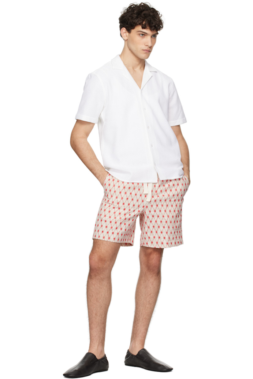 Leno-woven cotton shirt.

· Open spread collar
· Button closure
· Tennis-tail hem
· Pleats at back yoke

Supplier color: Cloud