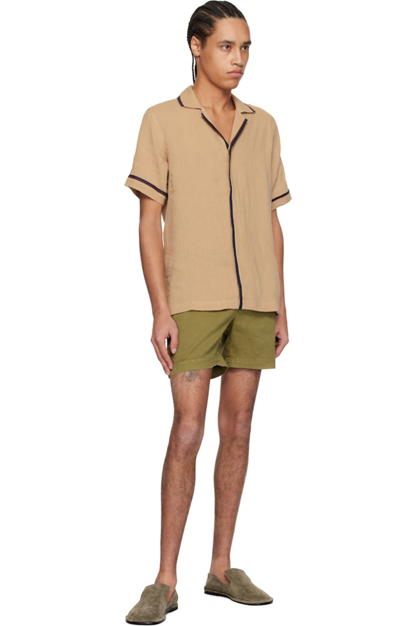 Linen hopsack shirt. Striped trim throughout.

· Open spread collar
· Concealed button closure
· Logo embroidered at side seam
· Vented side seams
· Pleats at back yoke

Supplier color: Biscuit/Damson/Night