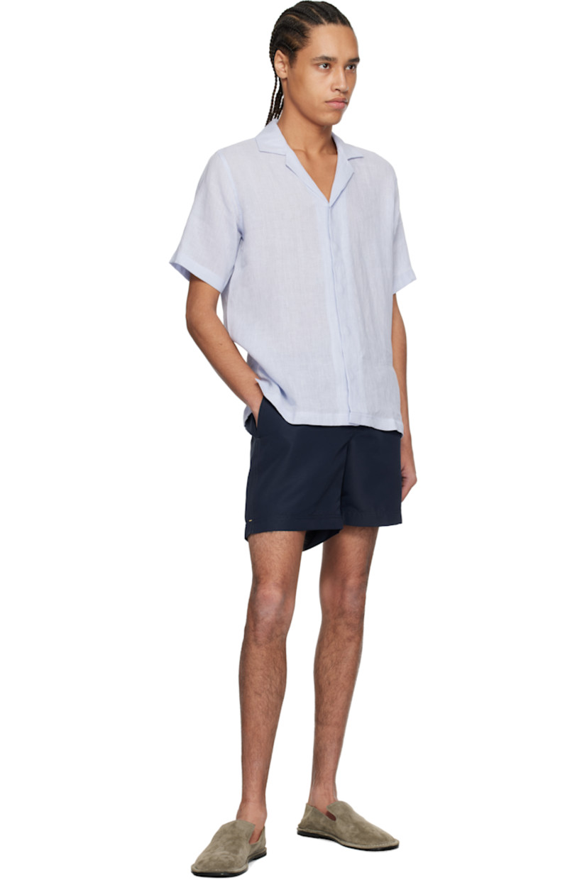 Linen hopsack shirt. 

· Open spread collar
· Concealed button closure
· Logo embroidered at side seam
· Vented side seams
· Pleats at back yoke

Supplier color: Hush