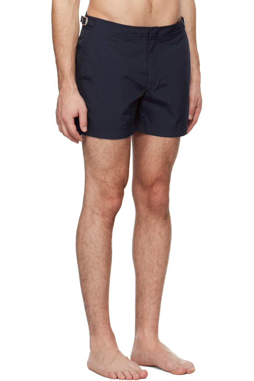 Quick-drying nylon taffeta swim shorts. 

· Three-pocket styling
· Zip-fly
· Vented cuffs
· Cinch tabs at waistband
· Logo flag at outseam
· Locker loop at back
· Briefs-style mesh lining

Supplier color: Navy