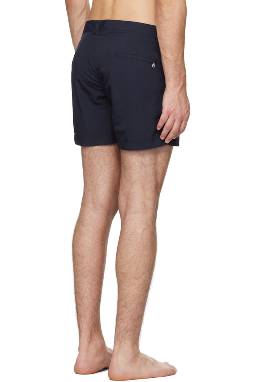 Quick-drying nylon taffeta swim shorts. 

· Three-pocket styling
· Zip-fly
· Vented cuffs
· Cinch tabs at waistband
· Logo flag at outseam
· Locker loop at back
· Briefs-style mesh lining

Supplier color: Navy