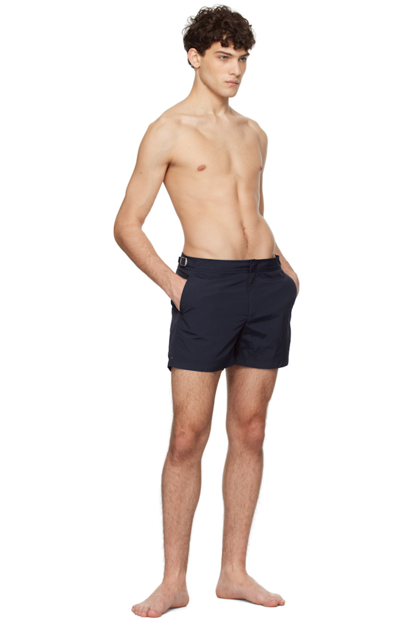 Quick-drying nylon taffeta swim shorts. 

· Three-pocket styling
· Zip-fly
· Vented cuffs
· Cinch tabs at waistband
· Logo flag at outseam
· Locker loop at back
· Briefs-style mesh lining

Supplier color: Navy
