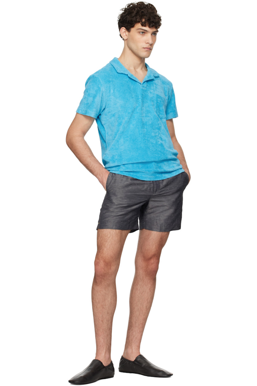 Organic cotton terrycloth polo.

· Spread collar
· Open placket
· Patch pocket at chest
· Tennis-tail hem
· Logo flag at side seam

Supplier color: Aqua blue