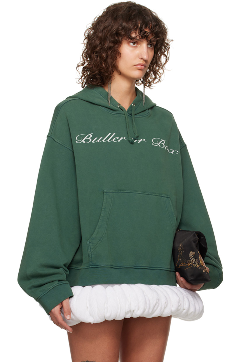 French terry hoodie. 

· Drawstring at hood
· Text printed at front
· Kangaroo pocket
· Rib-knit hem and cuffs
· Dropped shoulders

Supplier color: Bottle green