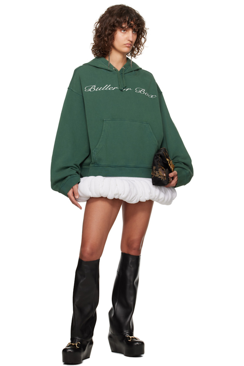 French terry hoodie. 

· Drawstring at hood
· Text printed at front
· Kangaroo pocket
· Rib-knit hem and cuffs
· Dropped shoulders

Supplier color: Bottle green