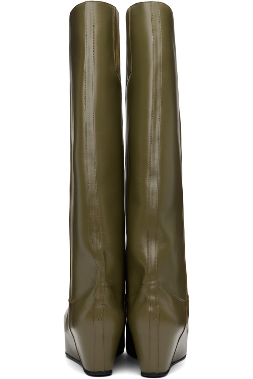 Knee-high buffed calfskin boots in khaki.

· Horsebit hardware at vamp
· Concealed elasticized gusset at inner side
· Covered platform midsole
· Leather sole with rubber injection
· Platform: H2.5"

Supplier color: Olive