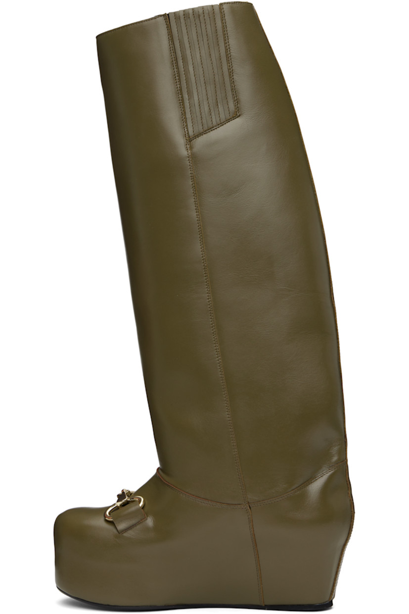 Knee-high buffed calfskin boots in khaki.

· Horsebit hardware at vamp
· Concealed elasticized gusset at inner side
· Covered platform midsole
· Leather sole with rubber injection
· Platform: H2.5"

Supplier color: Olive