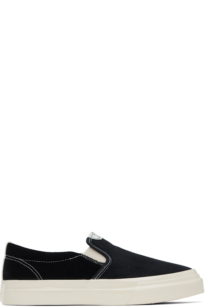 Low-top suede and textured canvas slip-on sneakers in black. 

· Logo patch at tongue
· Elasticized gussets
· Padded collar
· Mesh lining
· Treaded rubber sole
· Contrast stitching in white

Supplier color: Black