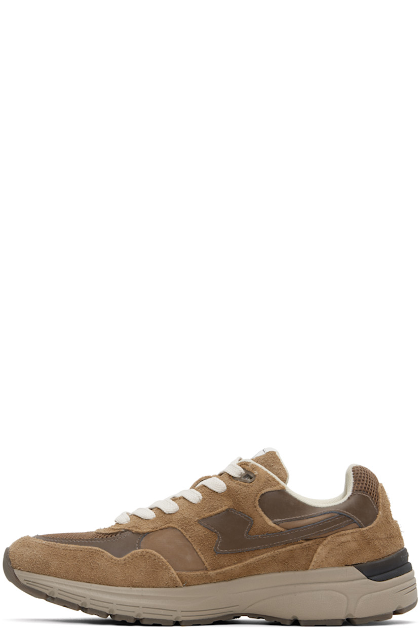 Low-top Geo-Merged® suede and mesh sneakers in brown.

· Logo embossed at toe
· Lace-up closure
· Logo patch at tongue
· Padded collar
· Text printed at outer side
· Logo embossed at heel counter
· Mesh lining
· Textured foam rubber midsole
· Treaded rubber sole

Supplier color: Brown