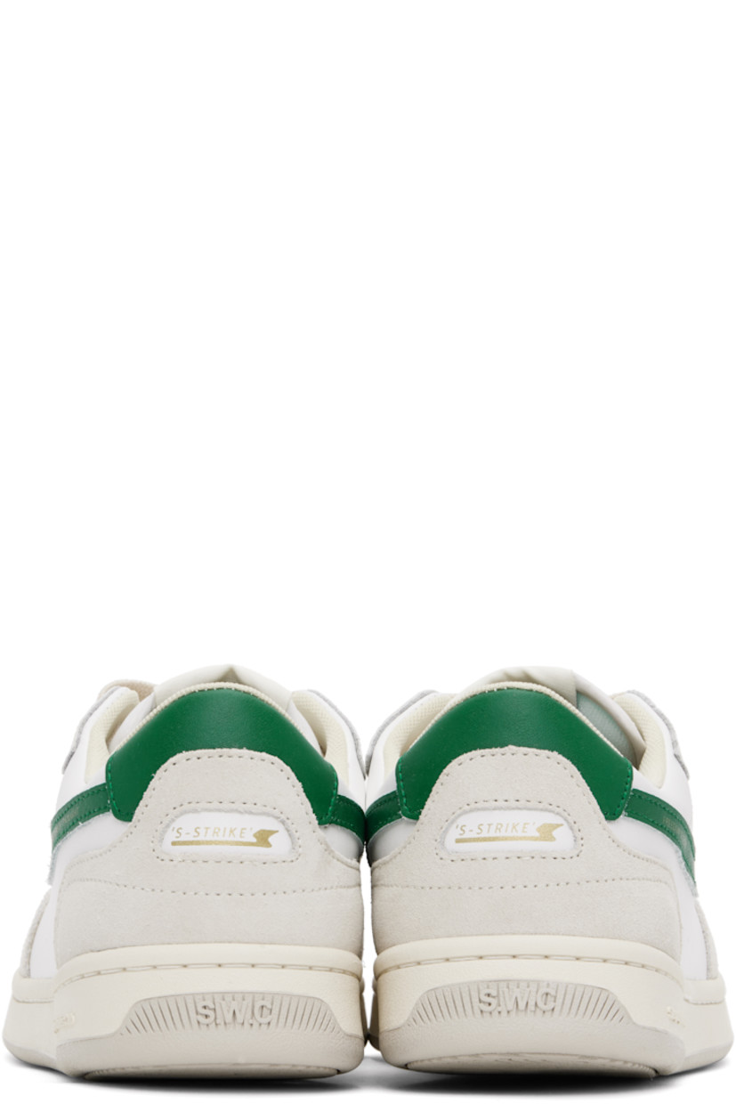 Low-top buffed leather and suede sneakers in white.

· Perforated detailing at toe
· Lace-up closure
· Logo patch at tongue
· Padded collar
· Text printed at outer side and heel
· Logo embossed at midsole
· Mesh lining
· Treaded rubber sole

Supplier color: White/Green