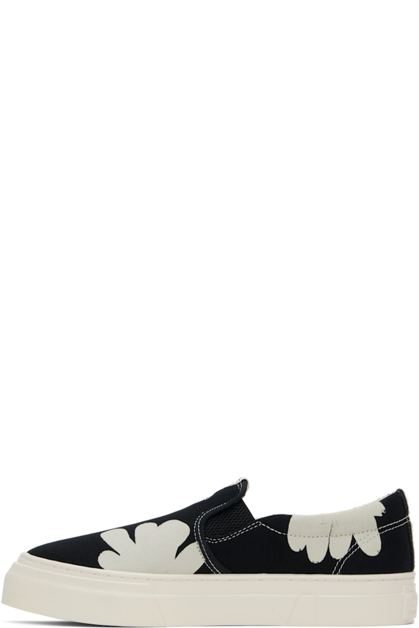 Low-top canvas slip-on sneakers in black and white.

· Graphics printed throughout
· Logo patch at tongue
· Elasticized gussets
· Padded collar
· Mesh lining
· Logo embossed at midsole 
· Treaded rubber sole
· Contrast stitching in white

Supplier color: Black/White