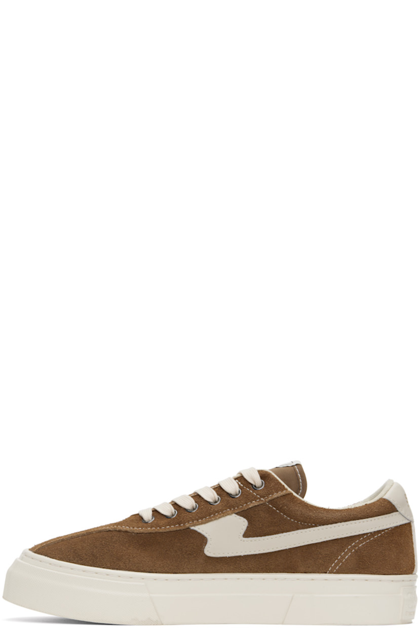 Low-top suede and buffed leather sneakers in brown and white.

· Lace-up closure
· Logo patch at padded tongue
· Padded collar
· Text printed at outer side
· Logo printed at heel tab
· Mesh lining
· Logo embossed at midsole
· Treaded rubber sole
· Contrast stitching in white

Supplier color: Brown