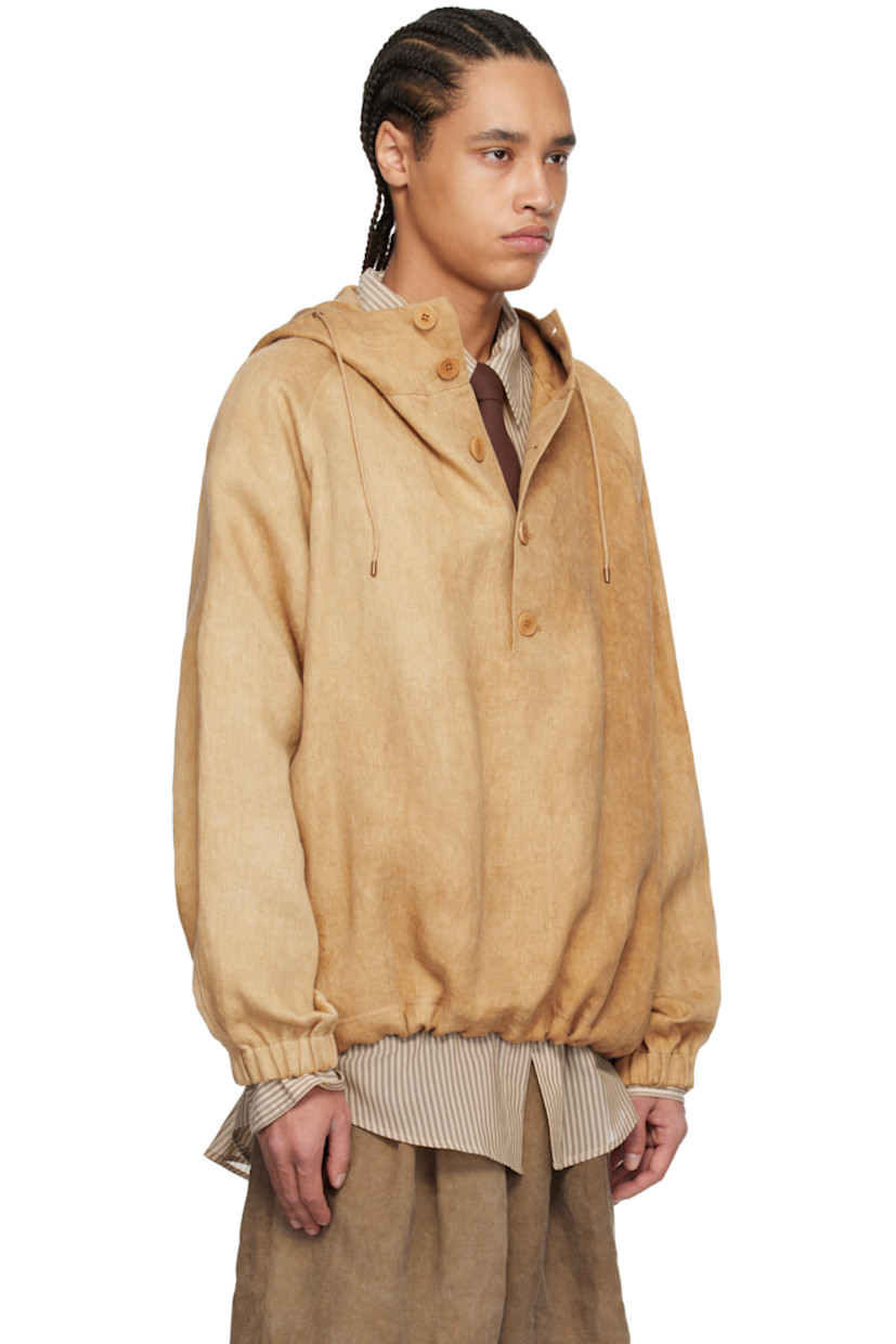 Linen twill jacket. Fading throughout.

· Drawstring at hood
· Stand collar
· Five-button placket
· Drawstring at hem
· Raglan sleeves
· Elasticized cuffs
· Corozo hardware

Supplier color: Hard wash beige