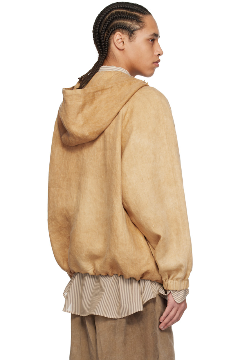 Linen twill jacket. Fading throughout.

· Drawstring at hood
· Stand collar
· Five-button placket
· Drawstring at hem
· Raglan sleeves
· Elasticized cuffs
· Corozo hardware

Supplier color: Hard wash beige