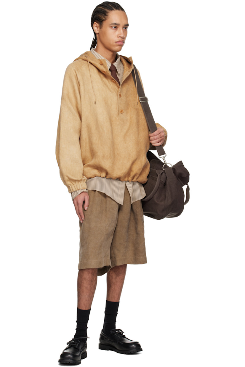 Linen twill jacket. Fading throughout.

· Drawstring at hood
· Stand collar
· Five-button placket
· Drawstring at hem
· Raglan sleeves
· Elasticized cuffs
· Corozo hardware

Supplier color: Hard wash beige