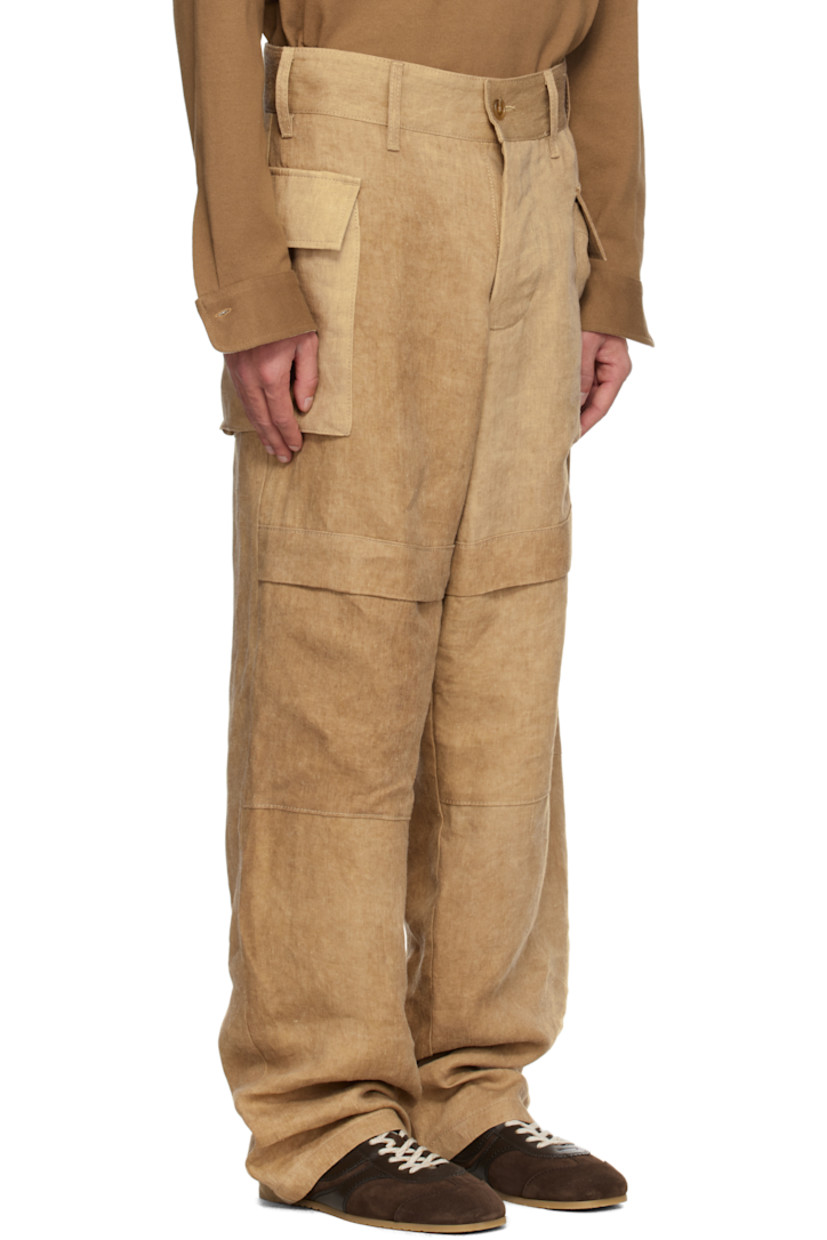 Washed linen twill cargo pants. Fading throughout. 

· Paneled construction
· Belt loops
· Button fly
· Flap at legs
· Flap pockets
· Horn hardware

Supplier color: Hard wash beige