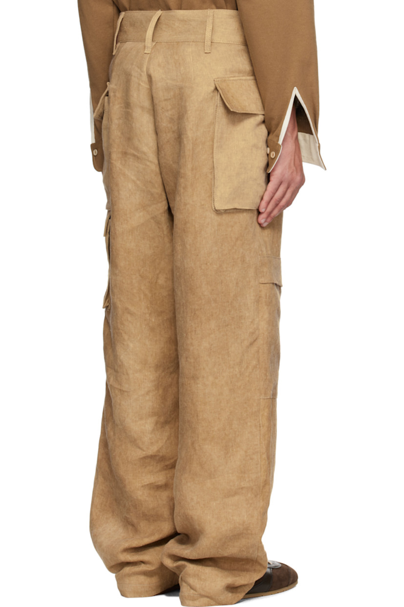 Washed linen twill cargo pants. Fading throughout. 

· Paneled construction
· Belt loops
· Button fly
· Flap at legs
· Flap pockets
· Horn hardware

Supplier color: Hard wash beige