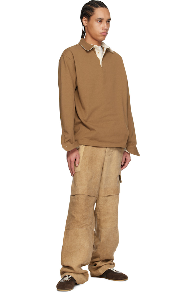 Washed linen twill cargo pants. Fading throughout. 

· Paneled construction
· Belt loops
· Button fly
· Flap at legs
· Flap pockets
· Horn hardware

Supplier color: Hard wash beige
