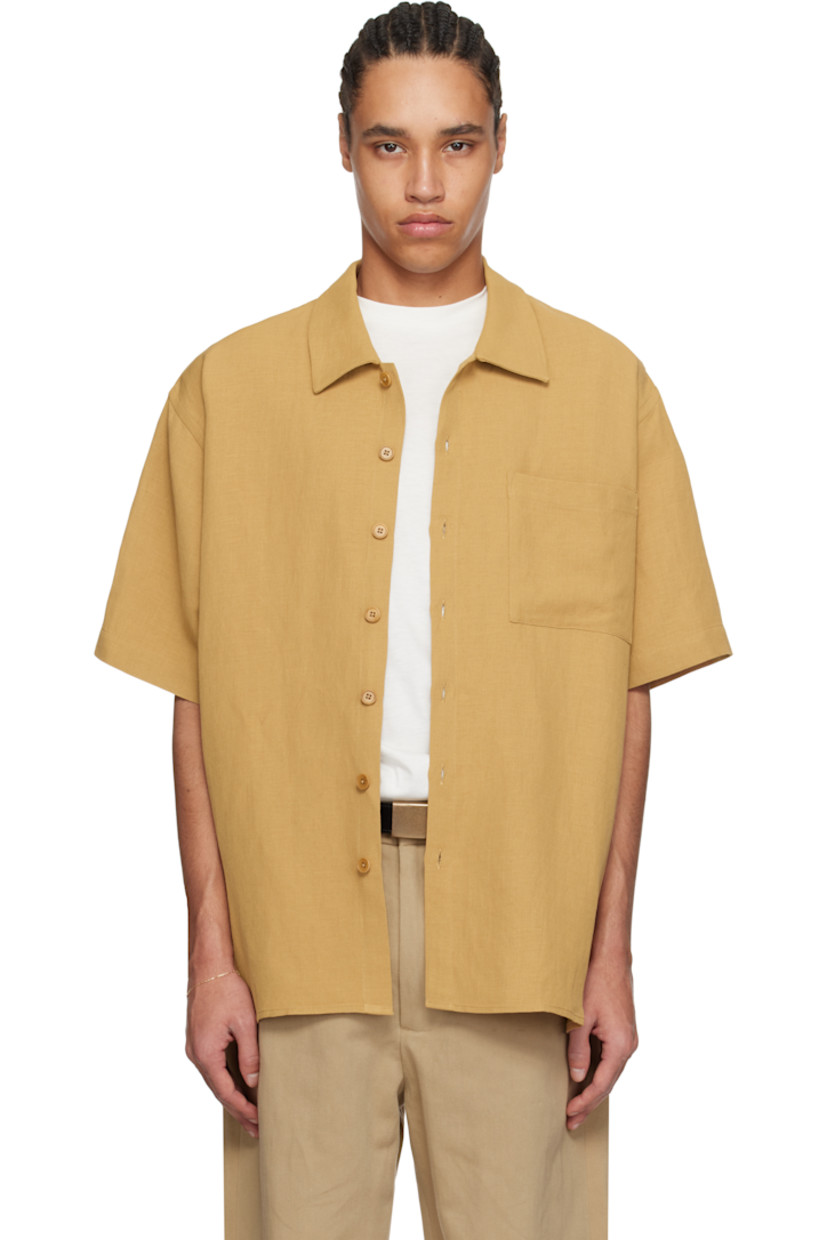 Oversized viscose- and linen-blend twill shirt. 

· Spread collar
· Button closure
· Patch pocket
· Curved hem
· Dropped shoulders
· Twin pleats at back yoke
· Corozo hardware

Supplier color: Burnt orange