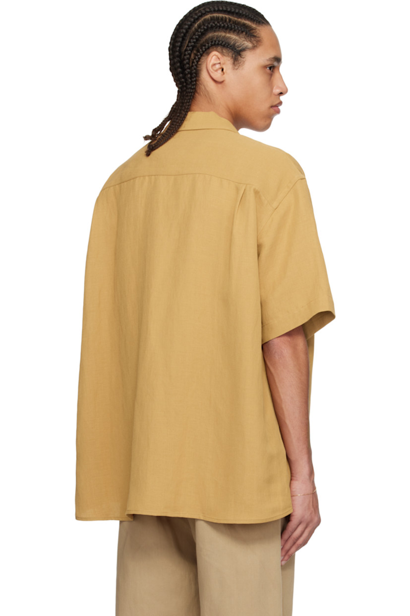 Oversized viscose- and linen-blend twill shirt. 

· Spread collar
· Button closure
· Patch pocket
· Curved hem
· Dropped shoulders
· Twin pleats at back yoke
· Corozo hardware

Supplier color: Burnt orange