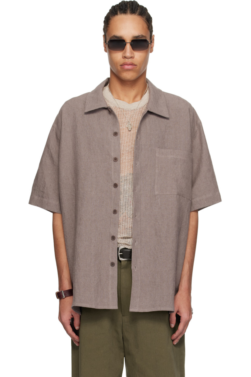 Oversized washed linen hopsack shirt. 

· Spread collar
· Button closure
· Patch pocket
· Curved hem
· Dropped shoulders
· Twin pleats at back yoke
· Corozo hardware

Supplier color: Wash purple
