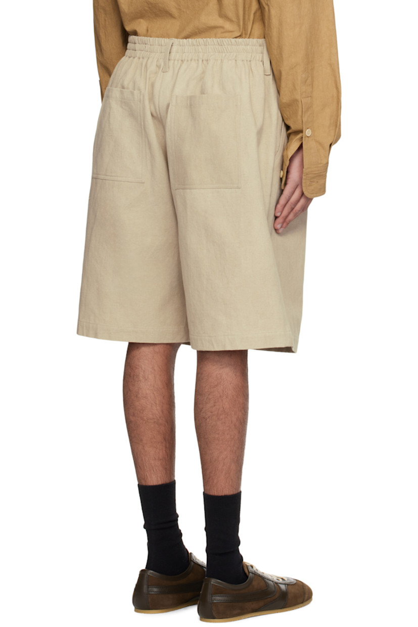 Loose-fit washed cotton- and ramie-blend canvas shorts. 

· Belt loops
· Partially elasticized waistband
· Four-pocket styling
· Lampo zip fly
· Pleats at front
· Horn hardware

Supplier color: Natural