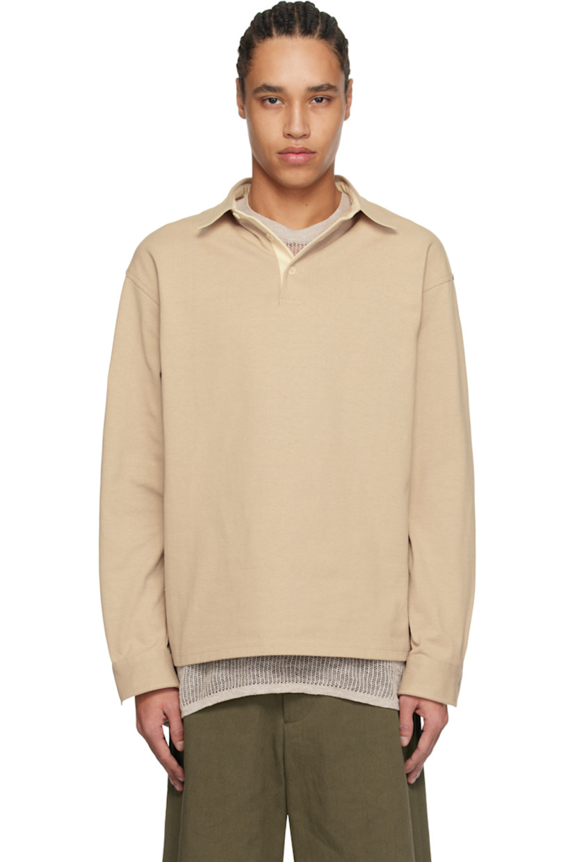 Cotton jersey polo. 

· Spread collar
· Three-button placket
· Dropped shoulders
· Adjustable single-button cuffs
· Twill panel at inner collar and cuffs
· Corozo hardware

Supplier color: Greige