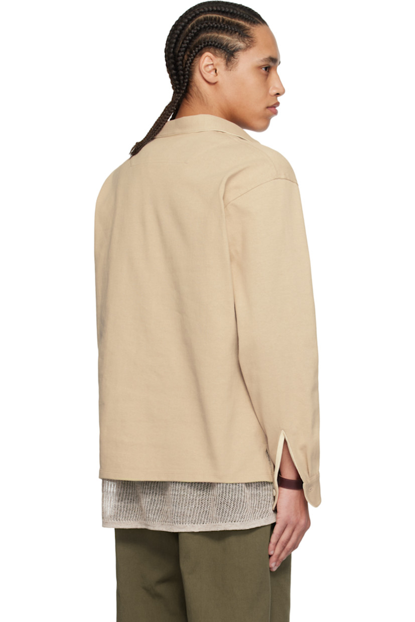Cotton jersey polo. 

· Spread collar
· Three-button placket
· Dropped shoulders
· Adjustable single-button cuffs
· Twill panel at inner collar and cuffs
· Corozo hardware

Supplier color: Greige