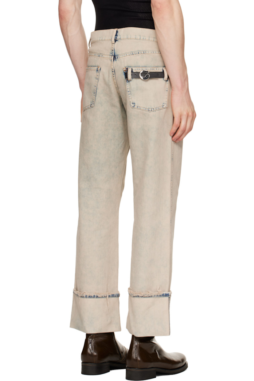 Loose-fit non-stretch denim jeans. Fading and distressing throughout.

· Mid-rise
· Belt loops
· Five-pocket styling
· Zip fly
· Rolled cuffs
· Strap with logo hardware at back pocket
· Contrast stitching in tan

Supplier color: Grey/Greige