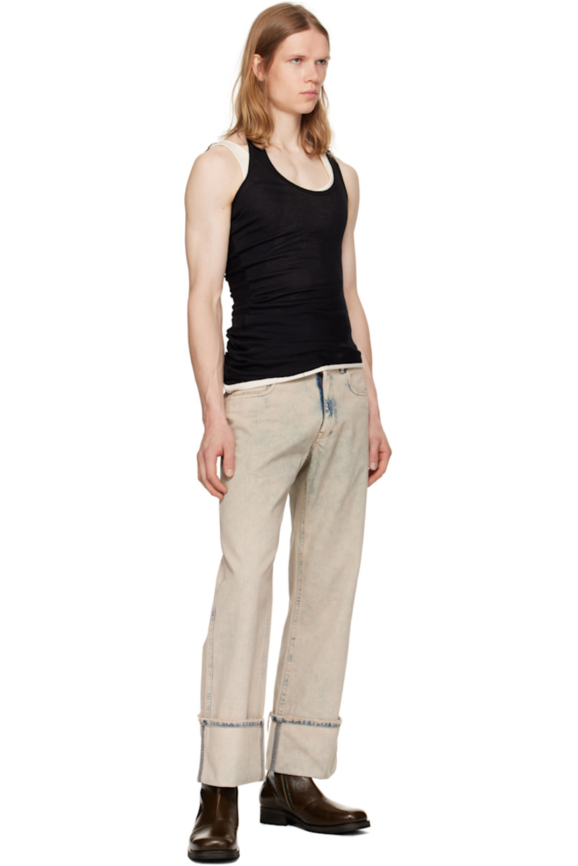 Loose-fit non-stretch denim jeans. Fading and distressing throughout.

· Mid-rise
· Belt loops
· Five-pocket styling
· Zip fly
· Rolled cuffs
· Strap with logo hardware at back pocket
· Contrast stitching in tan

Supplier color: Grey/Greige