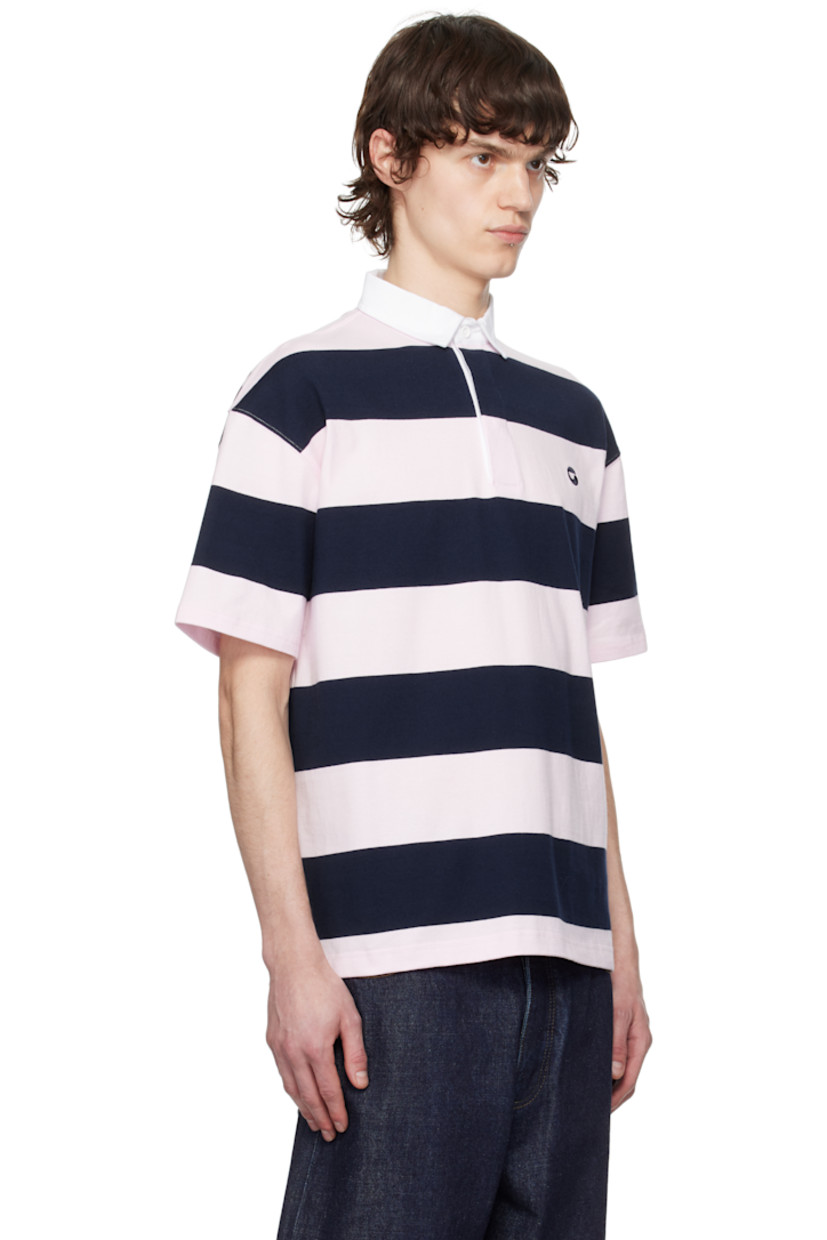 Cotton jersey polo. Stripes throughout.

· Cotton twill spread collar
· Concealed three-button placket
· Logo embroidered at chest
· Vented side seams
· Dropped shoulders

Supplier color: Pink/Blue
