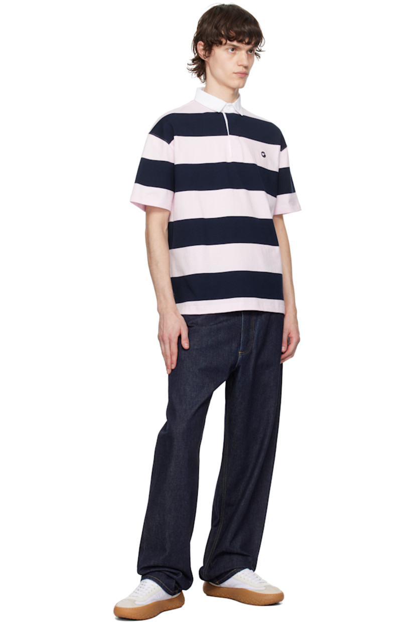 Cotton jersey polo. Stripes throughout.

· Cotton twill spread collar
· Concealed three-button placket
· Logo embroidered at chest
· Vented side seams
· Dropped shoulders

Supplier color: Pink/Blue