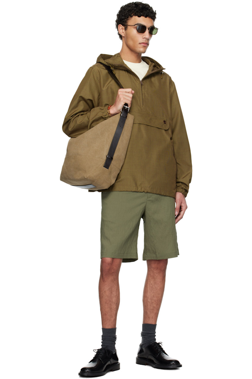 Silk canvas anorak. Check pattern throughout.

· Bungee-style drawstring at hood
· Stand collar
· Half-zip closure
· Logo embroidered at front
· Flap and zip pockets
· Bungee-style drawstring at hem
· Elasticized cuffs

Supplier color: Brown