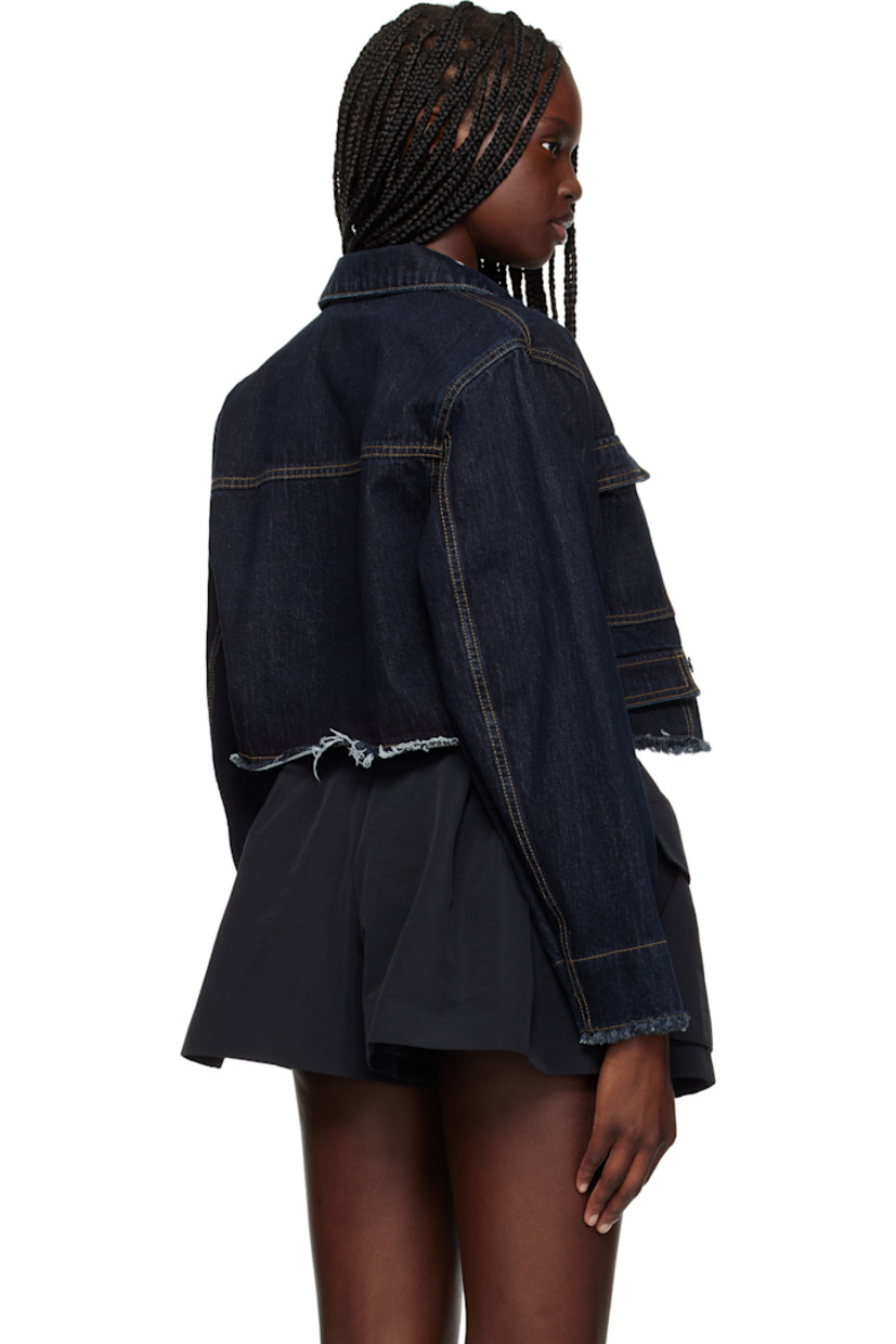 Non-stretch denim jacket. 

· Spread collar
· Button closure
· Flap pockets
· Logo embroidered at chest 
· Frayed edge at cropped hem and cuffs
· Dropped shoulders
· Contrast stitching in tan

Supplier color: Blue