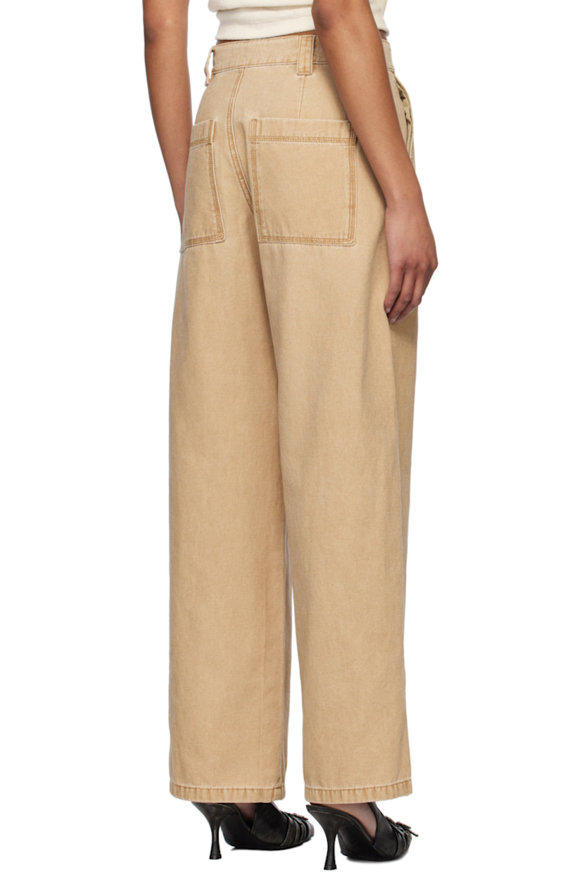 Cotton canvas trousers. Fading throughout.

· Mid-rise
· Belt loops
· Four-pocket styling
· Zip fly
· Logo embroidered at leg
· Vented outseams

Supplier color: Beige