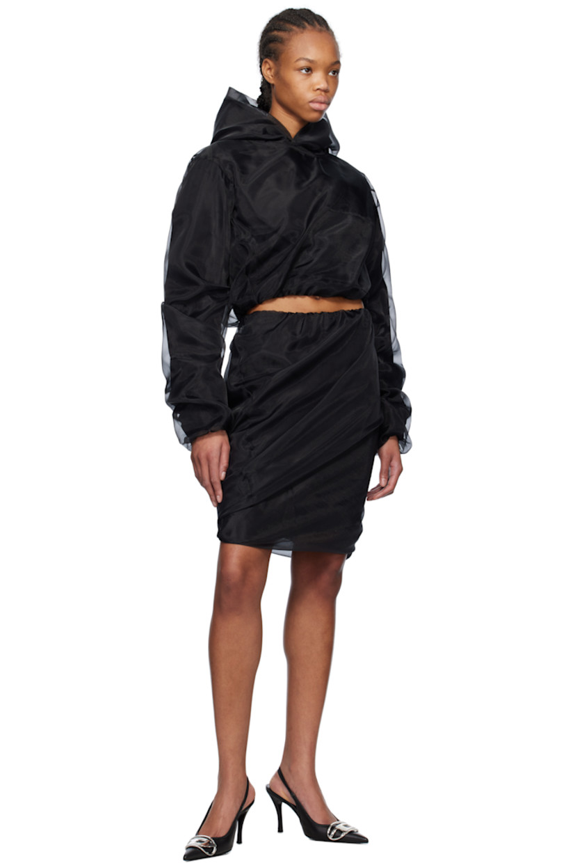 Polyester tulle and cotton-blend poplin hoodie. Gathering throughout.

· Layered construction 
· Kangaroo pocket
· Cropped bubble hem
· Elasticized hem and cuffs

Supplier color: Black