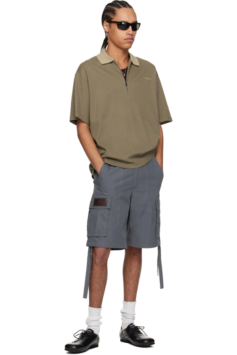 Cotton piqué polo.

· Rib-knit spread collar
· Half-zip closure
· Logo embroidered at chest
· Tennis-tail hem
· Logo flag at side seam
· Dropped shoulders

Supplier color: Stone brown/Beige